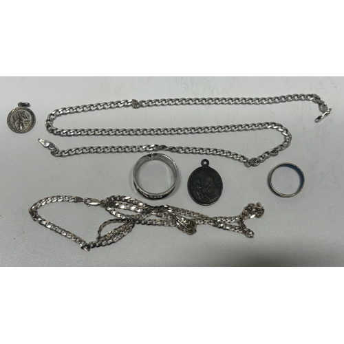 35 - Collection of silver including 2 chains and a pendant with 2 other rings

28.6g silver in the chains... 