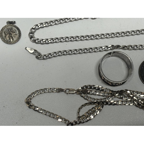 35 - Collection of silver including 2 chains and a pendant with 2 other rings

28.6g silver in the chains... 