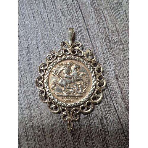 41 - 9ct yellow gold with tiny hallmark of a surround and a sovereign like coin marked 