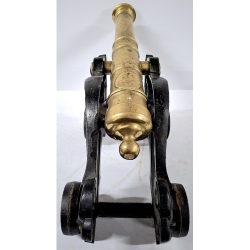 107 - Stunning large floor cannon cast in cast iron and brass,

Approx 47cm long