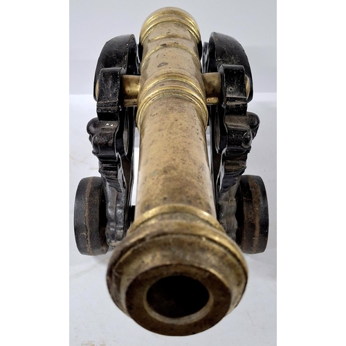 107 - Stunning large floor cannon cast in cast iron and brass,

Approx 47cm long