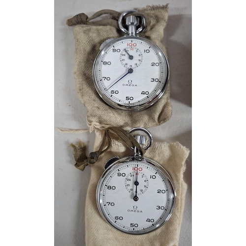 208 - Two boxed and retaining their original bags are 2 Omega stop watches (2)