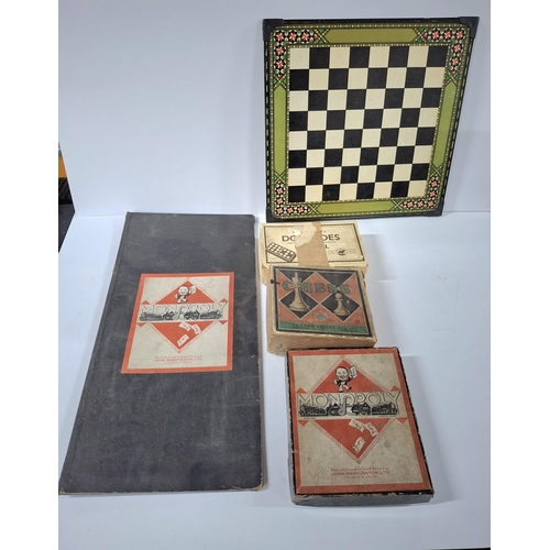 210 - Very old Monopoly which appears to be possibly complete together with an old chess set with resin pi... 