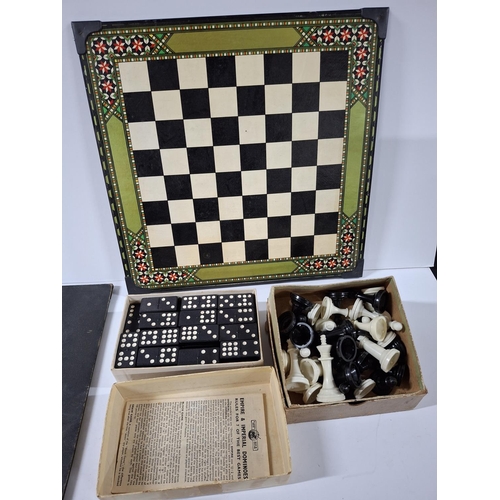 210 - Very old Monopoly which appears to be possibly complete together with an old chess set with resin pi... 