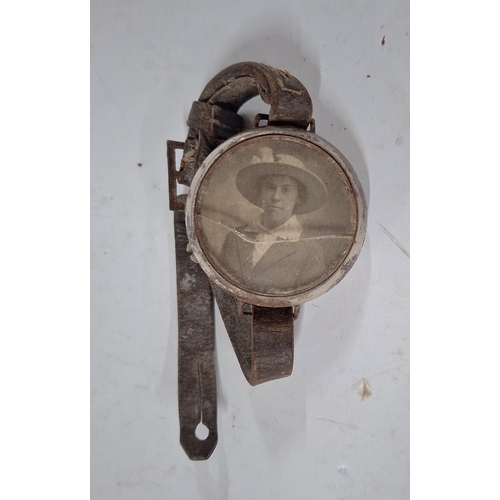 219 - A silver ladies Trench Watch along with a photo in a watch, as found