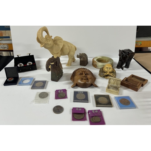 255 - Oriental items including resin elephant and coins