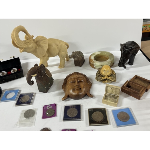 255 - Oriental items including resin elephant and coins