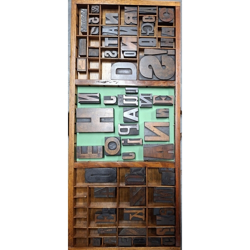 264 - Two old wooden printers trays, one with various sized wooden printing blocks