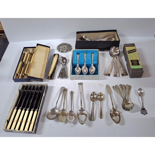 266 - Large collection of cutlery including 1 silver marked spoon, a metal broach and a razor