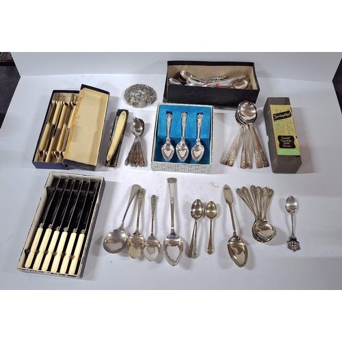 266 - Large collection of cutlery including 1 silver marked spoon, a metal broach and a razor