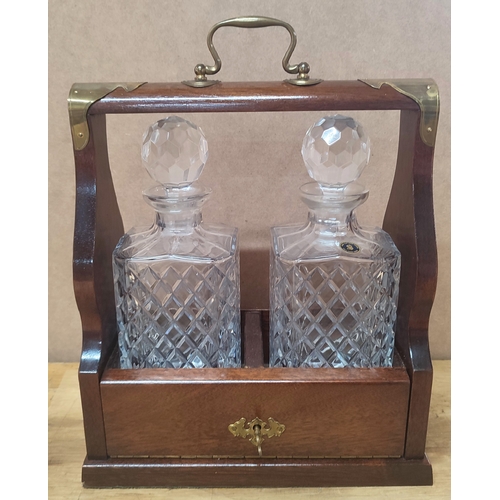 297 - Tantalus with two cut-glass decanters both with stoppers and key