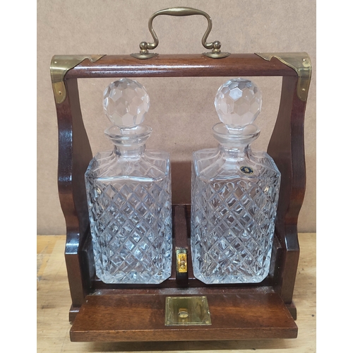 297 - Tantalus with two cut-glass decanters both with stoppers and key