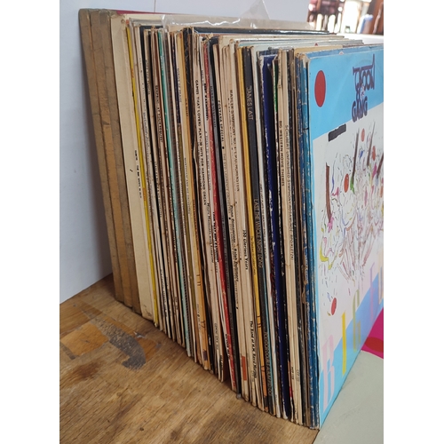 330 - Collection of various LP's across differing decades including New Order - The Beach, UB40, Madonna, ... 