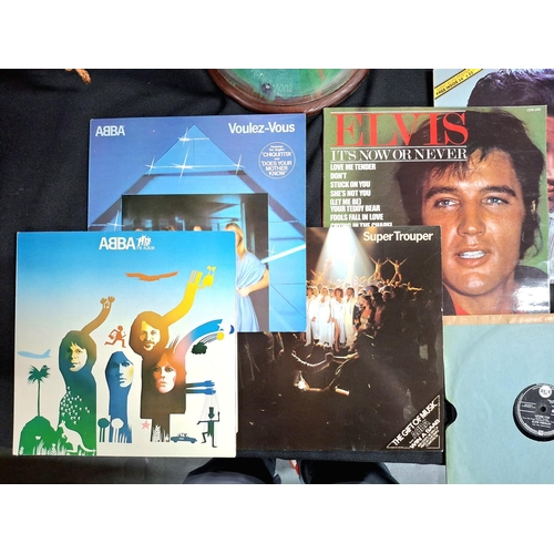 335 - Small collection of 1960s/70s records, LPs by Abba and Elvis Presley and singles by Cilla Black, Eve... 