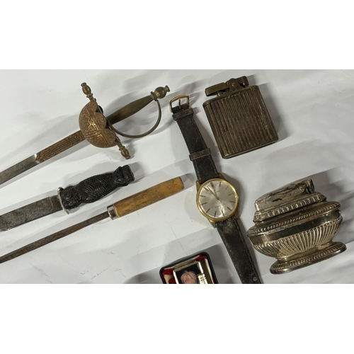 Collection of items including small daggers and lighters including Ronson