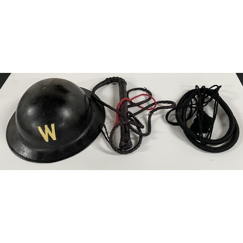 129 - A metal WWII Warden helmet complete with original inner together with 2 leather whips (3)