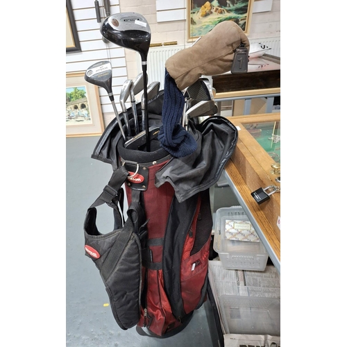 397 - Set of Wilson golf irons (3-SW) in a Wilson carry bag together with a Wilson Matrix driver and a Spa... 