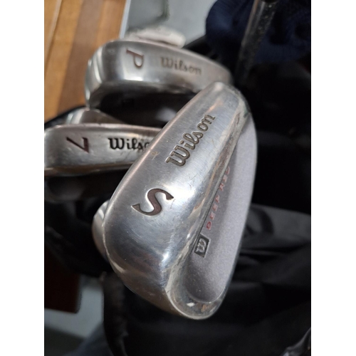 397 - Set of Wilson golf irons (3-SW) in a Wilson carry bag together with a Wilson Matrix driver and a Spa... 