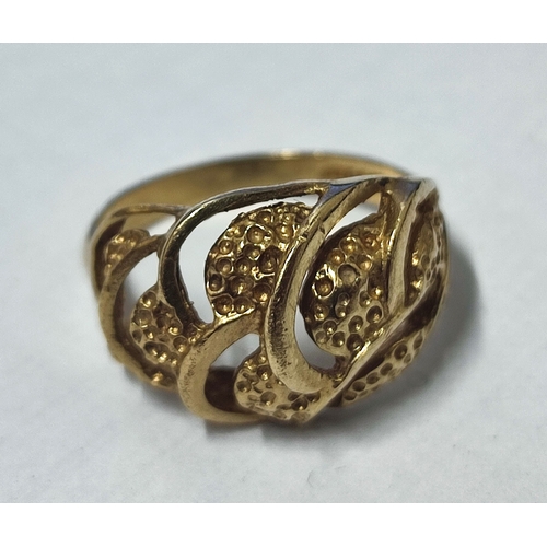 15B - A 9ct. hallmarked gold domed openwork patterned ring, 

size M,      3.3 grams