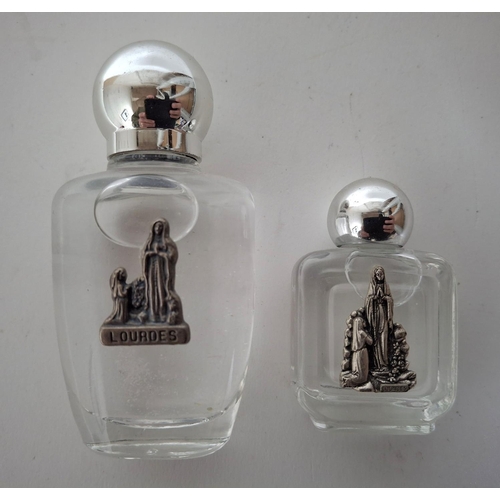 39 - Two small bottles containing Lourdes holy water (2)