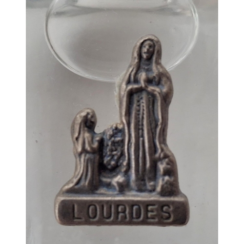 39 - Two small bottles containing Lourdes holy water (2)