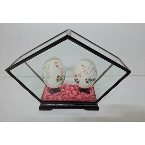 6 - Encased pair of hand painted Oriental eggs in fine quality display case