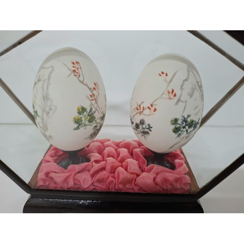 6 - Encased pair of hand painted Oriental eggs in fine quality display case