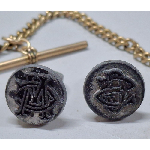 211 - Two non precious metal Albert chains together with 2 antique seal stamps, both containing interwoven... 