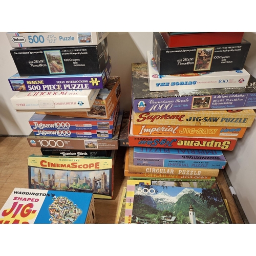 230 - Huge quantity of jigsaws (qty)