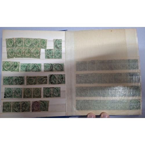 254 - Blue stock book containing a very large quantity of King George V 1913-1922 1/2d greens and 1d reds,... 