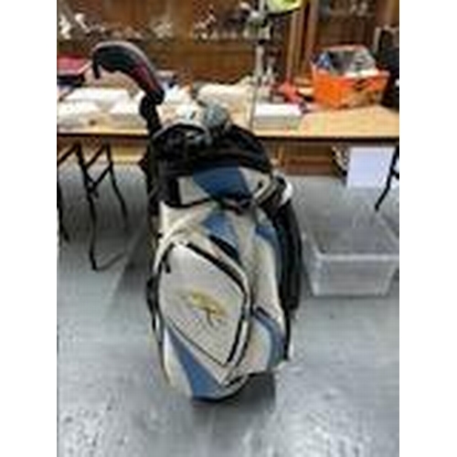 374 - Golf bag with some left handed clubs, includes Nike