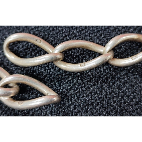 28 - A British hallmarked Silver chunky link chain together with a metal T-bar albert chain and a white m... 