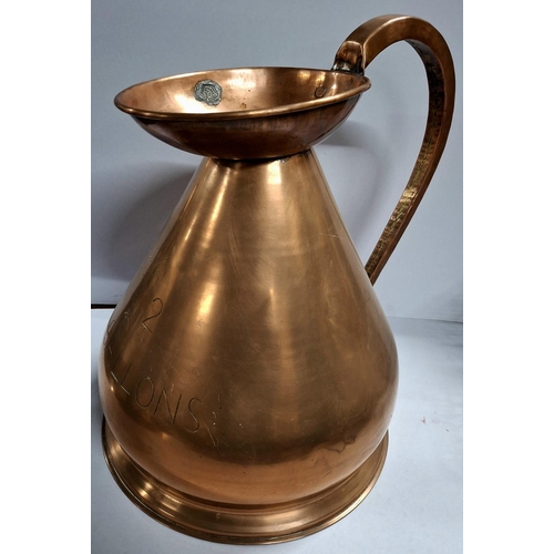 57 - Two gallon copper measuring jug