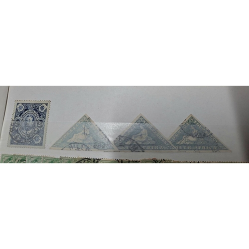 253 - Red stock book Containing South Africa, 3 Cape of Good Hope imperf triangle 4d blues, used together ... 