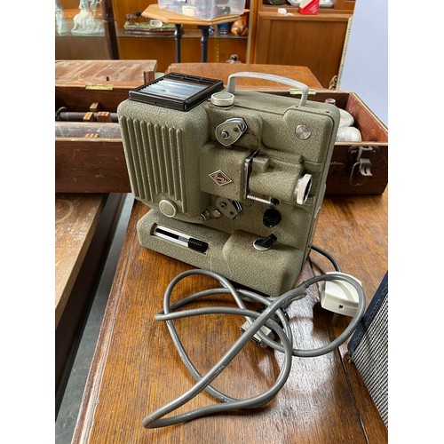 346 - Three items including a vintage radio, projector and a cased measuring device (3)