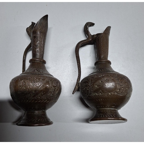 54 - Pair of small bronze ewer style jugs