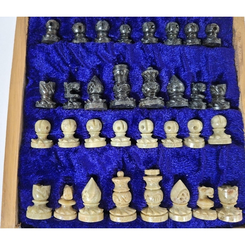 57 - Fine quality later 20thC chess set with carved soft stone pieces housed within a wooden carry box, t... 