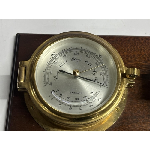 118 - Garrard barometers on wooden stand