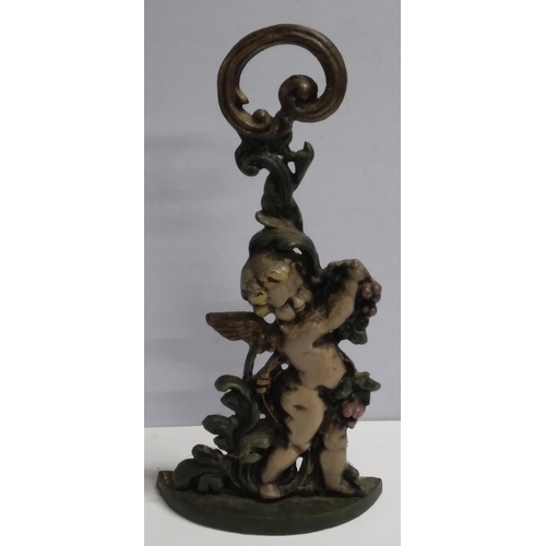 192 - Finely cast, old cast-iron door stop in the form of a cherub.