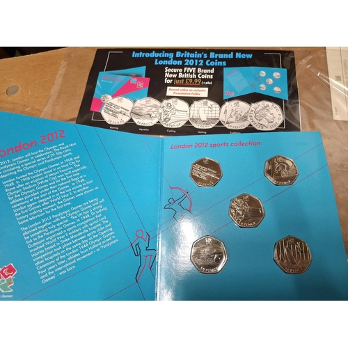 153 - Quantity of British QEII commemorative non silver coinage, many £5 examples, mostley with COAs or st... 