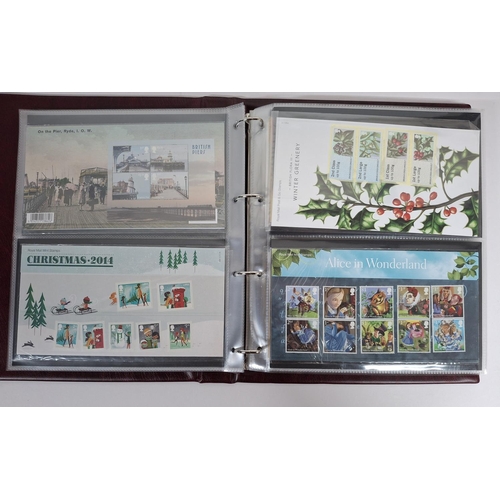 235 - Two burgundy Royal mail albums containing Queen Elizabeth GB stamp presentation packs October 2011-N... 