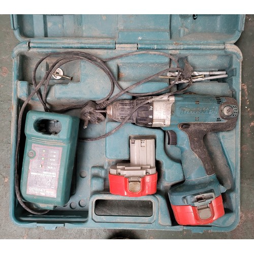 243 - Makita drill with battery and one other box (2)