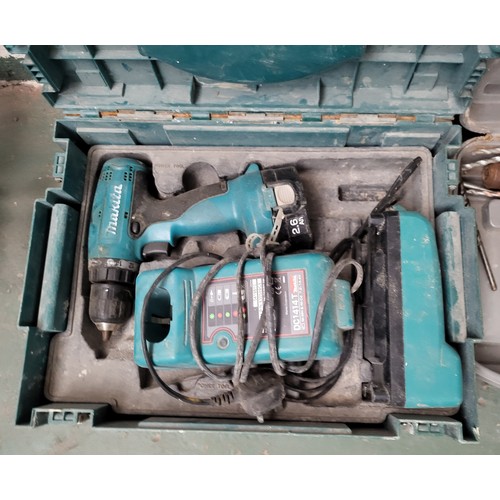 256 - Makita drill with charger and battery as well as a hammer drill (2)