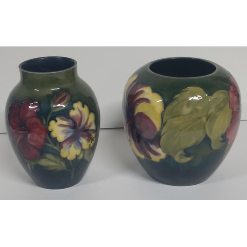 311 - Two Large old Moorcroft Hibiscus pattern squat vases, both signed to base (2)

Largest is 18cm tall