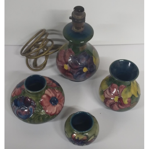 313 - Three old Moorcroft Hibiscus pattern small vases together with a matching Moorcroft table lamp, all ... 