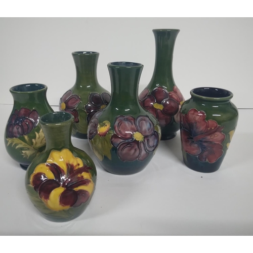 314 - Six old Moorcroft Hibiscus pattern small narrow necked vases, all are signed/marked to base (6),

Ta... 