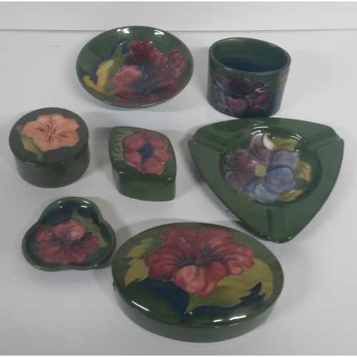 315 - Seven old Moorcroft Hibiscus pattern trinket boxes and pin dishes etc, all are signed/marked to base... 