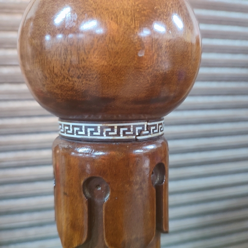 389 - An ornately carved floor lamp