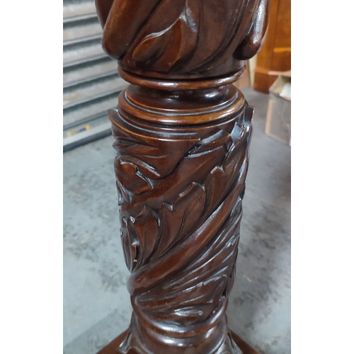 389 - An ornately carved floor lamp