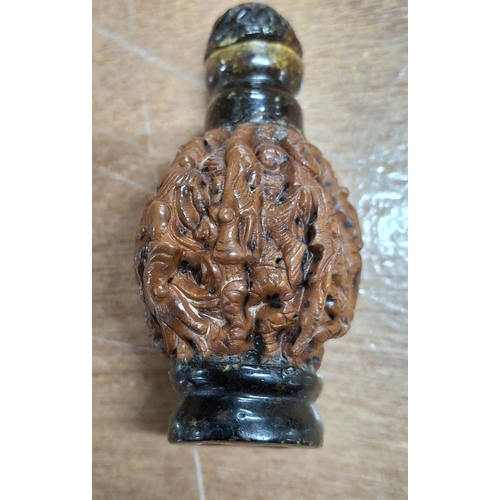 360 - Small intricately carved wooden Oriental snuff bottle